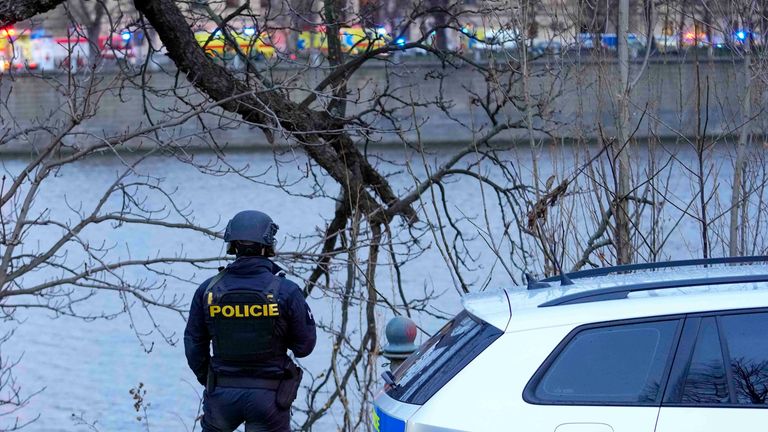 A police officer stands on the bank of the Vltava river in downtown Prague, Czech Republic
Pic:AP