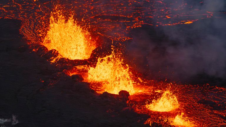 A close up of the Southern active segment of the original fissure of an active volcano in Grindavik on Iceland&#39;s Reykjanes Peninsula, Tuesday, Dec. 19, 2023. (AP Photo/Marco Di Marco)