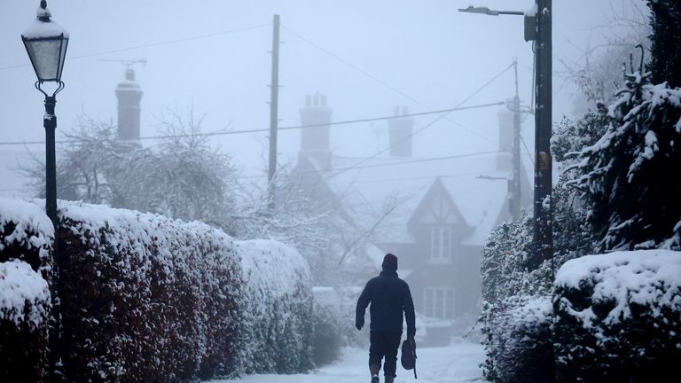 A man walks in the snow, Keele, Staffordshire, Britain, December 3, 2023. REUTERS/Carl Recine