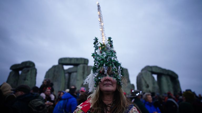 People take part in the winter solstice celebrations at the Stonehenge prehistoric monument on Salisbury Plain in Wiltshire. Picture date: Friday December 22, 2023. PA Photo. Photo credit should read: Ben Birchall/PA Wire