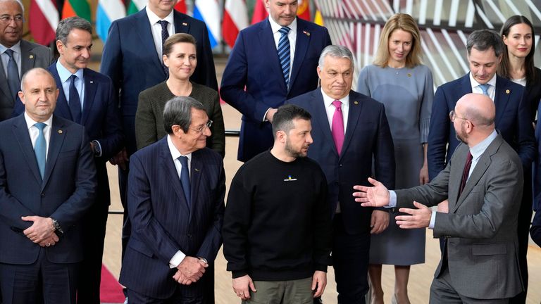 European Council President Charles Michel, front right, speaks with President Zelenskyy, front second right, and Hungary&#39;s Prime Minister Viktor Orban, second row center, at an EU summit in Brussels in February