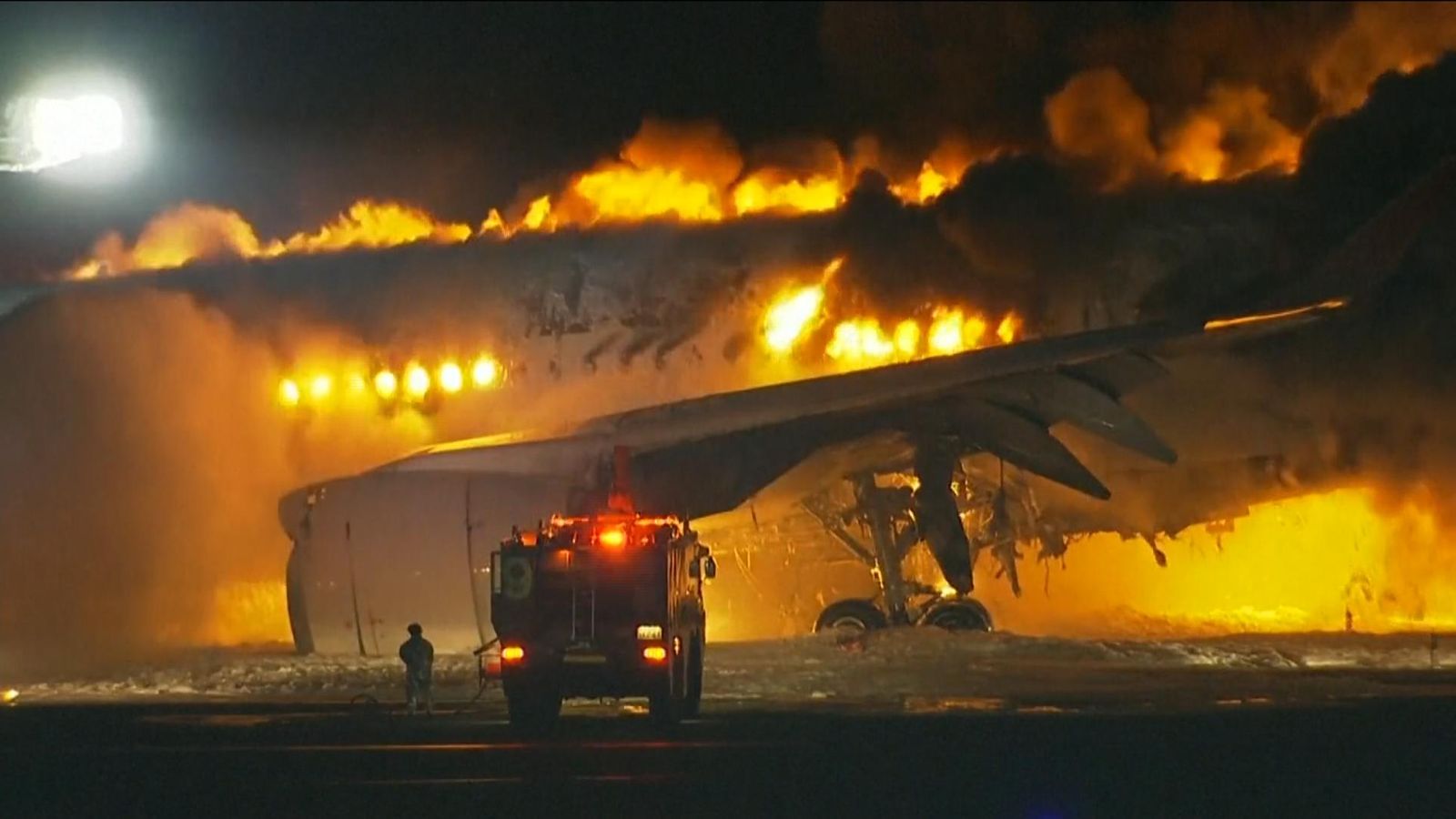 Plane bursts into flames on runway of Tokyo airport as hundreds of passengers escape