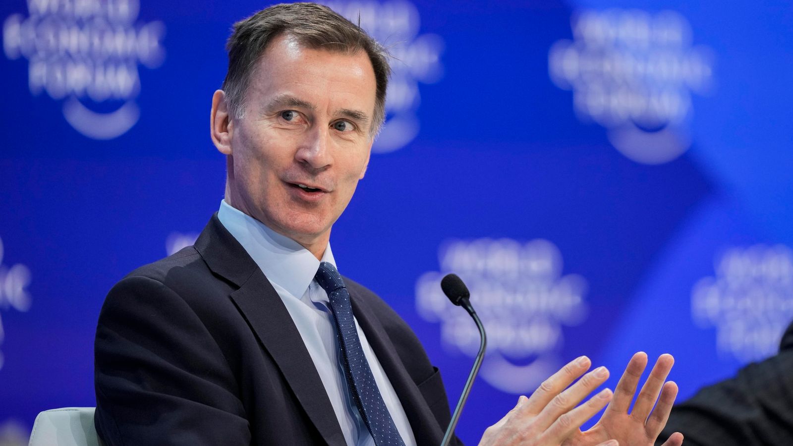 Davos: Jeremy Hunt signals tax-cutting budget ahead to help drive growth