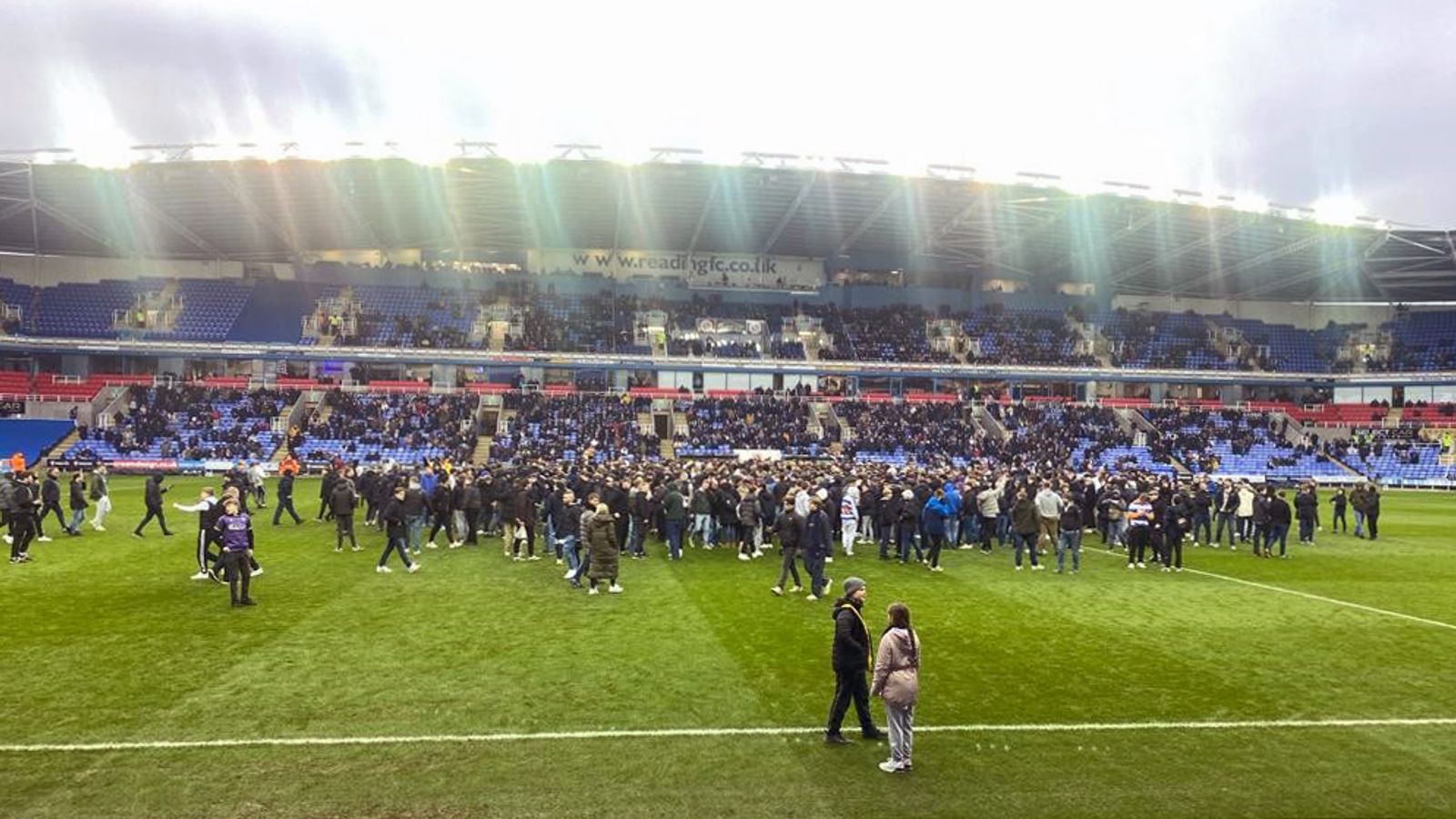 Reading vs Port Vale match abandoned after pitch invasion by fans protesting against Dai Yongge's ownership