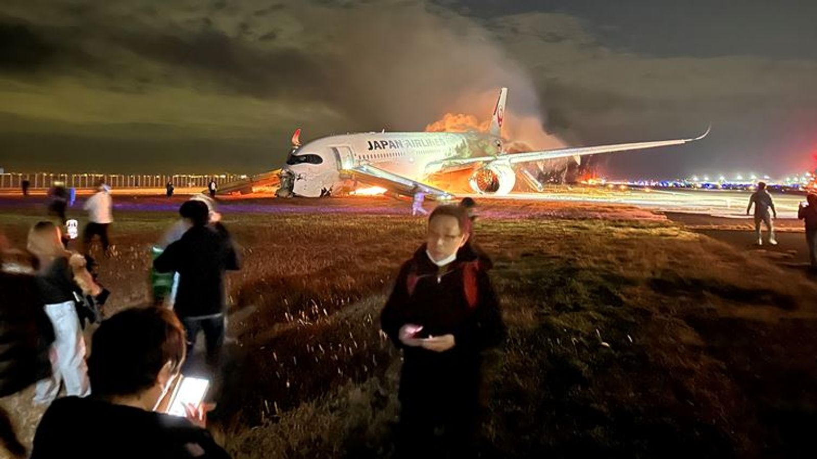 Japan plane fire: Family 'still in shock' after evacuating burning aircraft