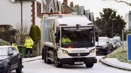 Refuse collectors clears the bin in snowy conditions in Briggswath, North Yorkshire, as weather warnings for snow and ice are in place across all four nations of the UK and more are expected to be issued as Arctic air sweeps across the country. Picture date: Tuesday March 7, 2023.