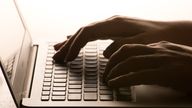 File photo dated 04/03/2017 of a woman's hands on a laptop keyboard. Issue date: Friday August 25, 2023.
