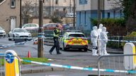 Police and forensic experts at the scene following the shooting. Pic: PA