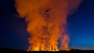 A helicopter flies near smoke rising as a volcano erupts in Grindavik, Iceland, on January 14, 2024. Icelandic Coast Guard/Handout via REUTERS THIS IMAGE HAS BEEN SUPPLIED BY A THIRD PARTY MANDATORY CREDIT NO RESALES. NO ARCHIVES TPX IMAGES OF THE DAY
