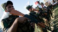 Members of Iraq&#39;s Shi&#39;ite militia Asaib Ahl al-Haq, who are supporters of Syrian President Bashar al-Assad, take part in a parade in Karbala March 21, 2014.REUTERS/Mushtaq Muhammed (IRAQ - Tags: CIVIL UNREST MILITARY POLITICS CONFLICT)
