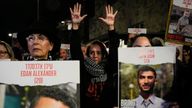 Relatives and supporters of the Israeli hostages held in the Gaza Strip by the Hamas militant group attend a protest calling for their release outside the Knesset, Israel&#39;s parliament, in Jerusalem, Monday, Jan. 22, 2024. Hebrew on the hands reads, "Time is running out". (AP Photo/Ohad Zwigenberg)
