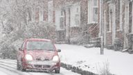 A car driving through a snow flurry in Lenham, Kent