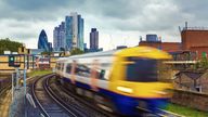 London Overground train with the gherkin in the background