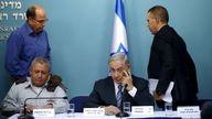 Benjamin Netanyahu pictured sitting alongside Gadi Eisenkot in 2015