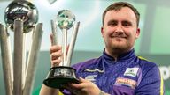 Luke Littler holds runners-up trophy of the World Darts Championship
