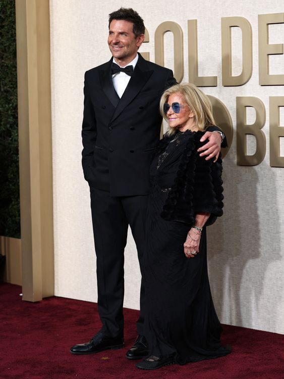 Gloria Campano and Bradley Cooper attend the 81st Annual Golden Globe Awards in Beverly Hills, California, U.S., January 7, 2024. REUTERS/Mike Blake

