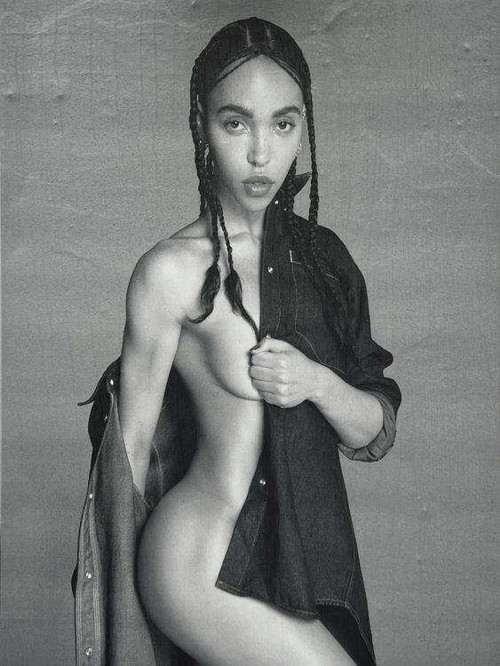 WEDNESDAY JANUARY 10 EDITORS NOTE: Nudity Undated handout photo issued by Advertising Standards Authority (ASA) of a poster for Calvin Klein featuring British musician FKA Twigs, which has been banned for being likely to cause serious offence by objectifying women. The poster, seen in April, featured the singer wearing a denim shirt that was drawn halfway around her body, leaving the side of her buttocks and half of one breast exposed, with text reading: "Calvins or nothing." Issue date: Wednesd