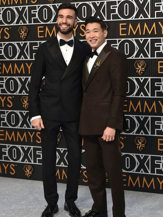 John-Michael Sudsina, left, and Joel Kim Booster arrive at the 75th Primetime Emmy Awards on Monday, Jan. 15, 2024, at the Peacock Theatre in Los Angeles. (Photo by Richard Shotwell/Invision/AP)