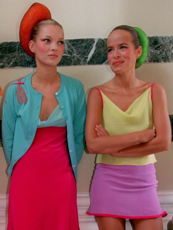 British models Kate Moss (L) and Jade Jagger wait to walk down the catwalk wearing clothes by designer Matthew Williamson, September 26. The show was the first by Williamson at London Fashion Week, and Moss and Jagger waived their modelling fees in return for being allowed to keep the clothes they were wearing. BRITAIN FASHION
