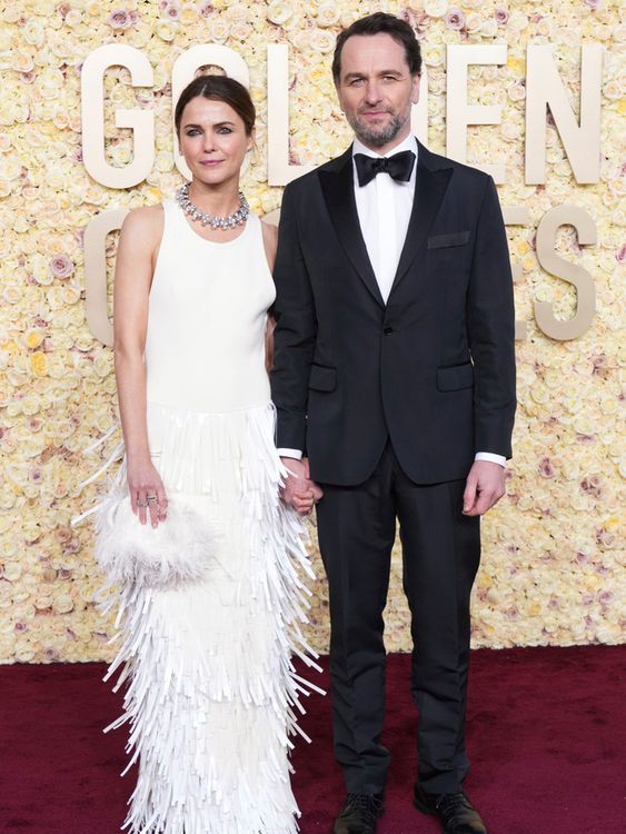 Keri Russell, left, and Matthew Rhys arrive at the 81st Golden Globe Awards on Sunday, Jan. 7, 2024, at the Beverly Hilton in Beverly Hills, Calif. (Photo by Jordan Strauss/Invision/AP)