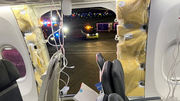 FILE PHOTO: Passenger oxygen masks hang from the roof next to a missing window and a portion of a side wall of an Alaska Airlines Flight 1282, which had been bound for Ontario, California and suffered depressurization soon after departing, in Portland, Oregon, U.S., January 5, 2024 in this picture obtained from social media. Instagram/@strawberrvy via REUTERS THIS IMAGE HAS BEEN SUPPLIED BY A THIRD PARTY. MANDATORY CREDIT.//File Photo