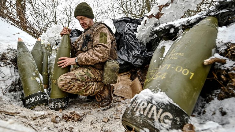 A Ukrainian serviceman prepares 155-mm artillery shells at a position near a front line, amid Russia&#39;s attack on Ukraine, in Zaporizhzhia region, Ukraine January 14, 2024. REUTERS/Stringer