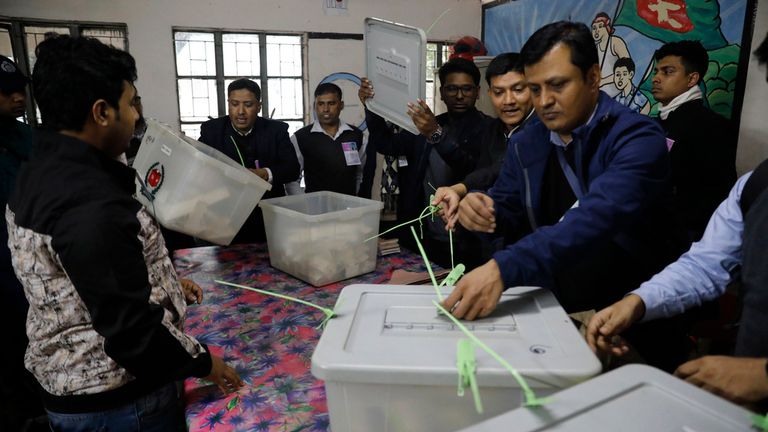 Officials prepare to count votes of parliamentary election in Dhaka, Bangladesh, Sunday, Jan 7, 2024. Voters in Bangladesh cast ballots Sunday in the election fraught with violence and a boycott from the main opposition party, paving the way for Prime Minister Sheikh Hasina and her Awami League to seize a fourth consecutive term. (AP Photo/Mahmud Hossain Opu)