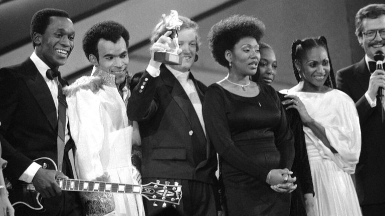 International pop group ...Boney M.... presents the ...Special Lion Trophy ...85... of Radio Television Luxemburg at Dortmund Westfalia Hall on Saturday, Oct. 13, 1985. The ...Special Lion... was awarded to the group for most famous international songs. Third from left is producer Frank Farian.  (AP Photo/Karl-Heinz Kreifelts)