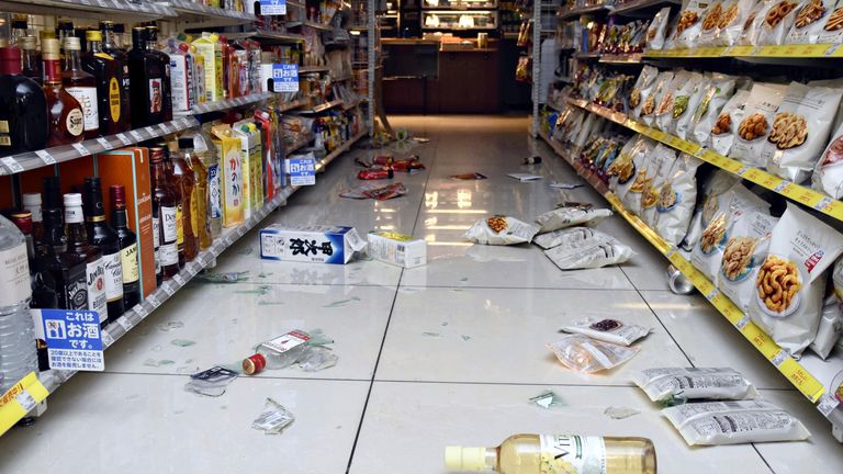 Bottles and other items are fallen on a floor at a shop in Toyama City, Toyama Prefecture, Japan, after an earthquake. Pic: AP