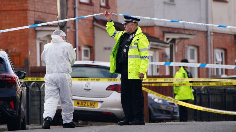 Police and forensic investigators at the scene. Pic: PA