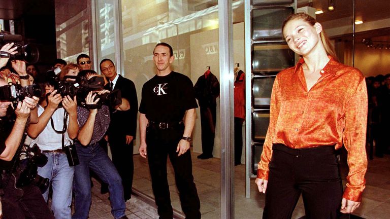Supermodel Kate Moss (R) is surrounded by photographers outside Calvin Klein's first dedicated designer store for Hong Kong September 5. Moss, who models regularly for the designer and features in most of the company's advertising campaigns, flew in especially to mark the occasion.
