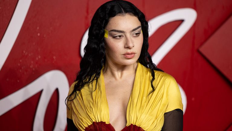 Charli XCX poses for photographers upon arrival at the British Fashion Awards on Monday, Dec. 4, 2023 in London. (Vianney Le Caer/Invision/AP)