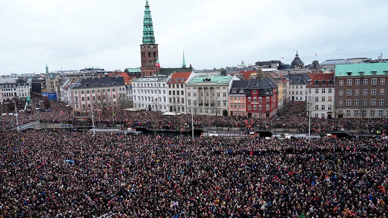 People gather on the day Danish Queen Margrethe abdicates after 52 years on the throne, and her elder son, Crown Prince Frederik, ascends the throne as King Frederik X, in Copenhagen, Denmark, January 14, 2024. Ritzau Scanpix/Mads Claus Rasmussen via REUTERS ATTENTION EDITORS - THIS IMAGE WAS PROVIDED BY A THIRD PARTY. DENMARK OUT. NO COMMERCIAL OR EDITORIAL SALES IN DENMARK.