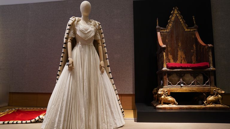 A replica of Queen Elizabeth II &#39;s Coronation ordaining dress and the coronation chair, which is part of the collection of more than 450 costumes, sets and props from the Netflix series The Crown, on show at Bonhams in central London, ahead of being auctioned next month. Picture date: Tuesday January 9, 2024.

