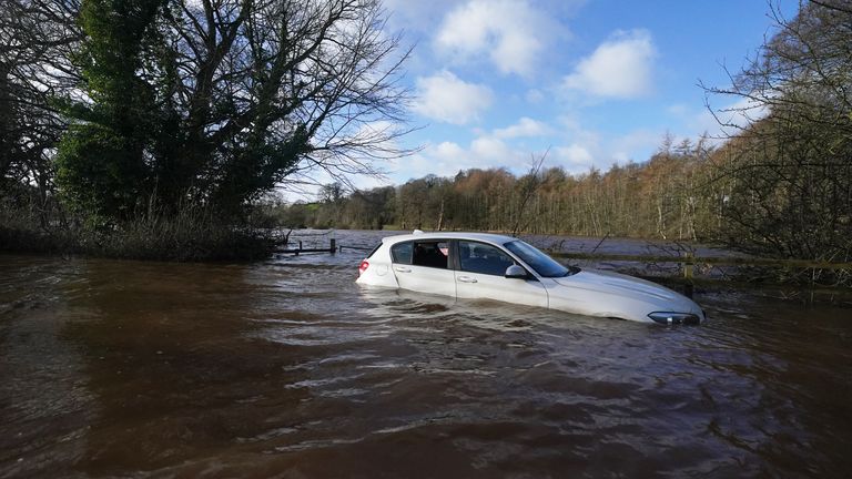 A car stranded in flood water in Warwick bridge in Cumbria