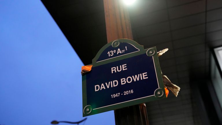 CORRECTS YEAR - The street sign of singer David Bowie is pictured after being unveiled in Paris, Monday, Jan. 8, 2024. The city of Paris is immortalizing late British music icon David Bowie by naming a street after him in the city&#39;s southeast on what would have been his 77th birthday on Monday. (AP Photo/Christophe Ena)