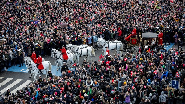 Denmark&#39;s newly proclaimed King Frederik and Queen Mary ride in a carriage, following the abdication of former Queen Margrethe who reigned for 52 years, in Copenhagen, Denmark, January 14, 2024. Ritzau Scanpix/Ida Marie Odgaard via REUTERS ATTENTION EDITORS - THIS IMAGE WAS PROVIDED BY A THIRD PARTY. DENMARK OUT. NO COMMERCIAL OR EDITORIAL SALES IN DENMARK.