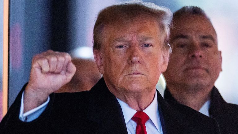 Donald Trump gestures as he leaves Trump Tower in New York to attend the trial hearing. Pic: Reuters