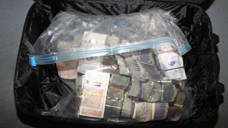 Recovered money in a suitcase. Pic: NCA