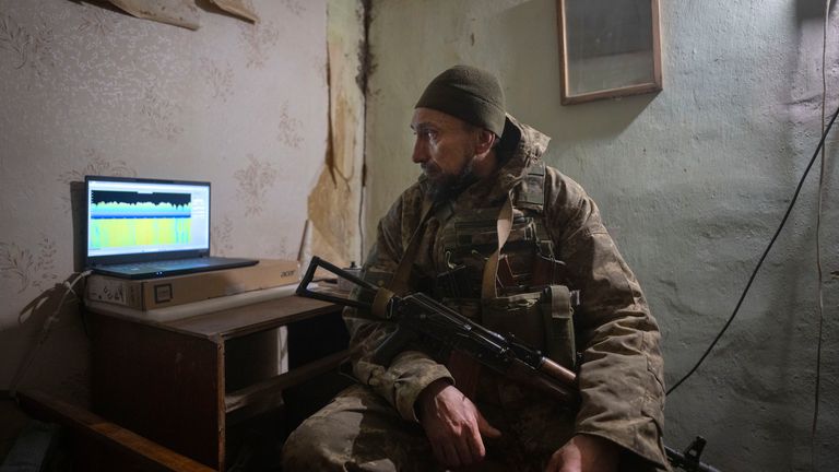 A Ukrainian serviceman looks at a monitor of an electronic warfare system to combat Russian drones at the front line, in a shelter near Bakhmut
Pic: AP