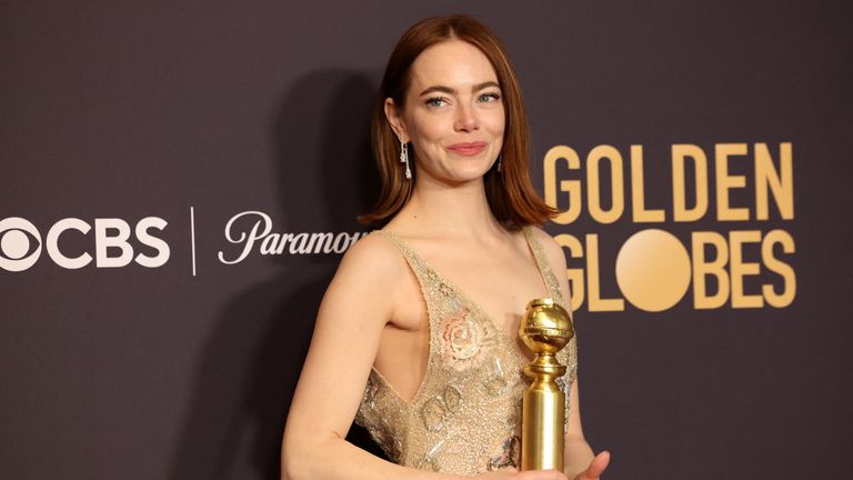Emma Stone poses with the award for Best Performance by a Female Actor in a Motion Picture - Musical or Comedy for "Poor Things", at the 81st Annual Golden Globe Awards in Beverly Hills, California, U.S., January 7, 2024. REUTERS/Mario Anzuoni
