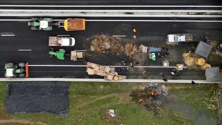French farmers block the A61 highway with their tractors 
Pic: Reuters