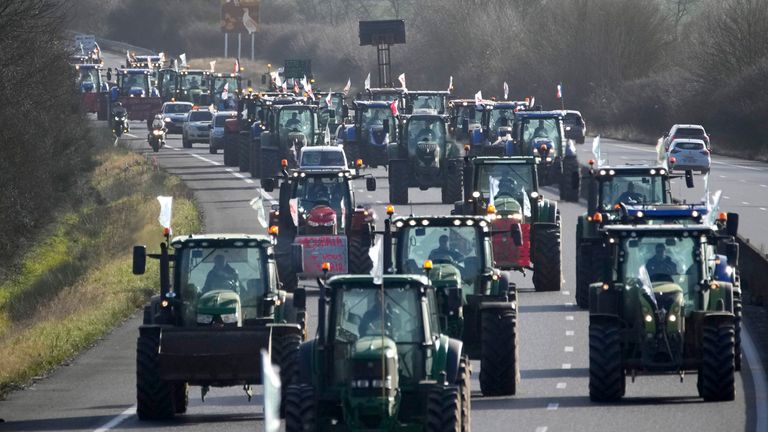 Farmers on their way to a blockade with tractors as part of the protests. Pic: AP