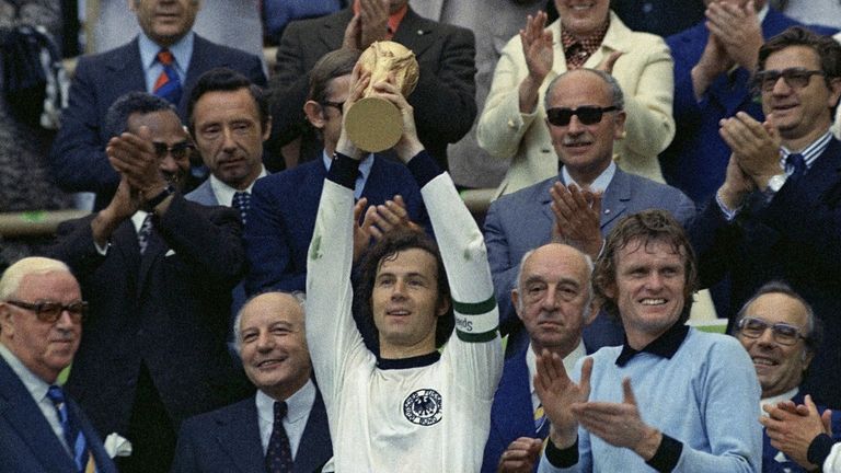 FILE - West Germany captain Franz Beckenbauer holds up the World Cup trophy after his team defeated the Netherlands by 2-1, in the World Cup soccer final at Munich's Olympic stadium, in West Germany, on Jul. 7, 1974. German soccer great Franz Beckenbauer has died at 78, news agency dpa reports. (AP Photo, File)



