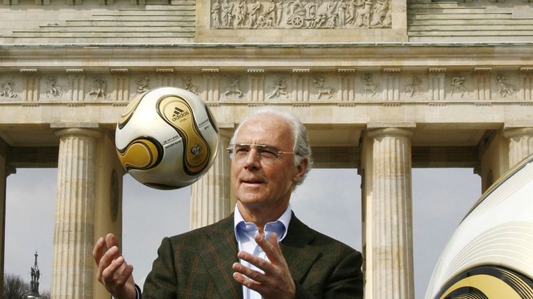 FILE - German soccer legend Franz Beckenbauer, head of Germany&#39;s organising committee for the soccer World Cup, plays with the Golden Ball for the World Cup in front of the Brandenburg Gate in Berlin, on April 18, 2006.