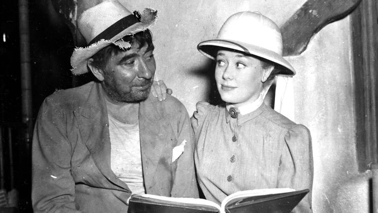 Glynis Johns with Robert Newton during a script rehearsal on the set of &#39;The Beachcomber&#39; in 1954