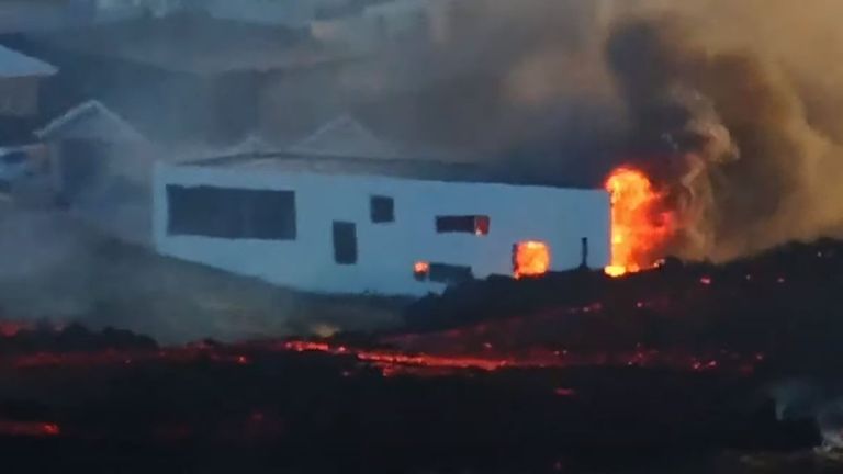 Lava burns a building on the edge of Grindavik, Iceland, following a volcanic eruption. Screenshot from live Sky stream 