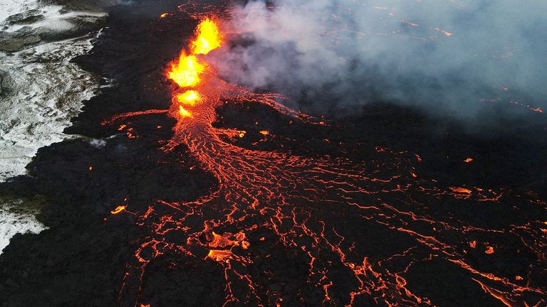 A drone picture shows lava spewing from the site of the volcanic eruption north of Grindavik, photographed from Sylingarfell, Iceland, December 19, 2023. REUTERS/Sigurdur Davidsson