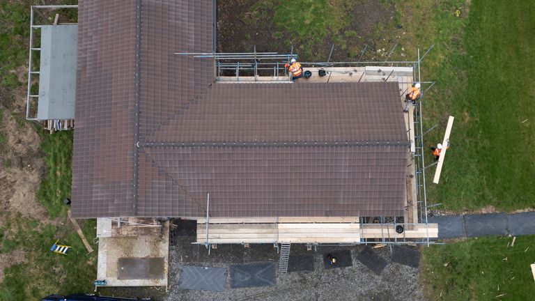 Workers fit scaffolding ahead of works to demolish an unauthorised spa pool block at the home of Hannah Ingram-Moore
Pic:PA