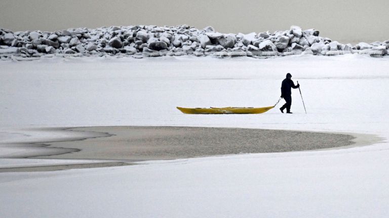 A man walks on the frozen sea in southern Helsinki, 